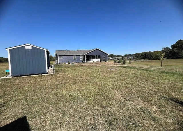 a view of an ocean house and a yard
