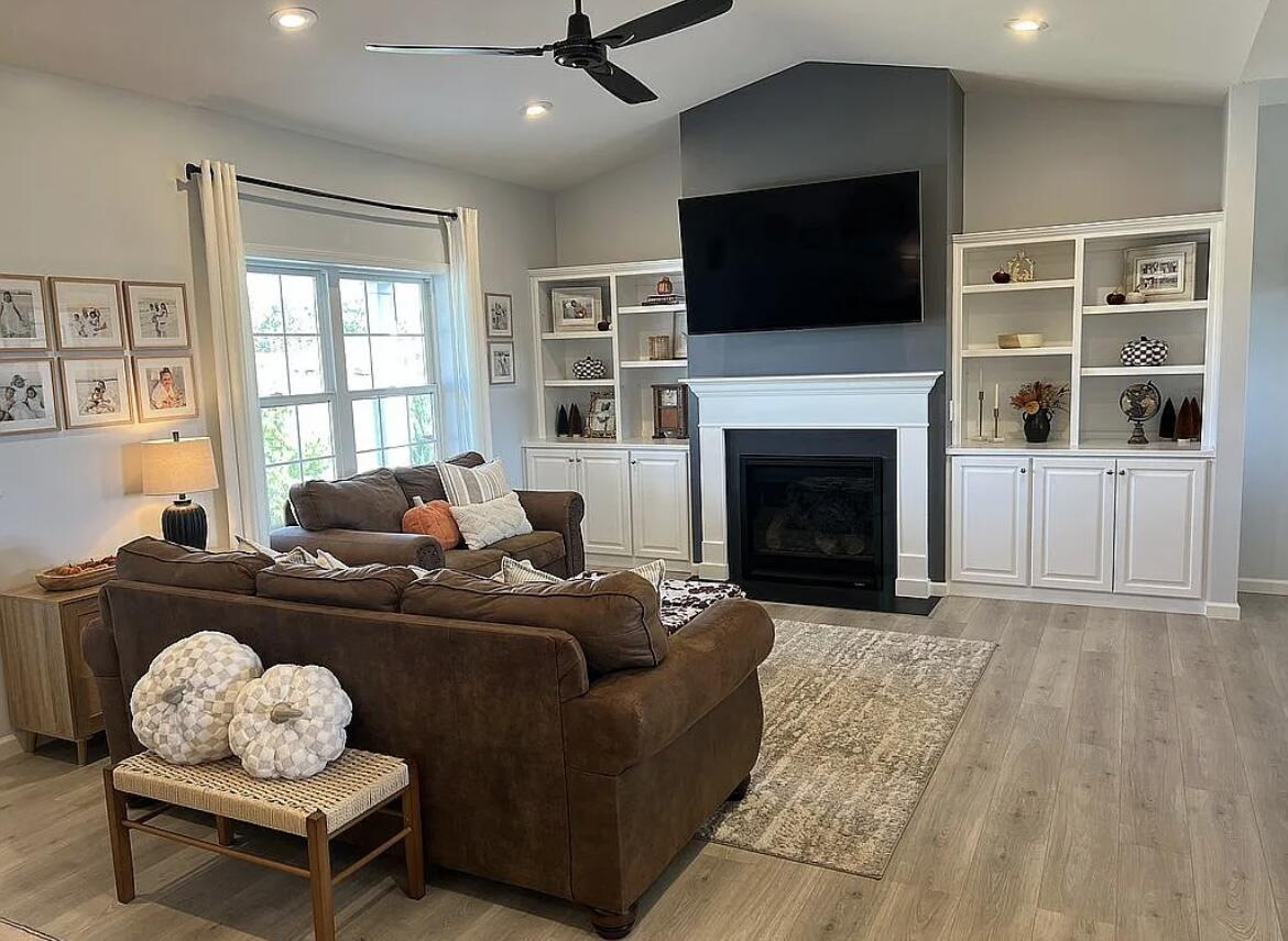 6227 East Sarver Lane Argenta, IL 62501 - Photo 6 of 20 a living room with furniture a flat screen tv and a fireplace