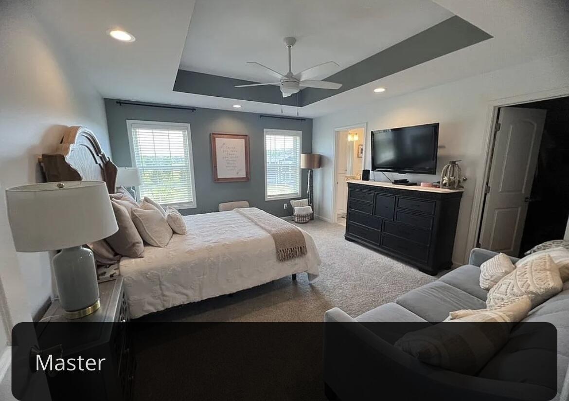 6227 East Sarver Lane Argenta, IL 62501 - Photo 7 of 20 a bedroom with a bed and a television