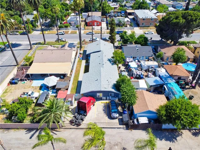 an aerial view of a houses with yard