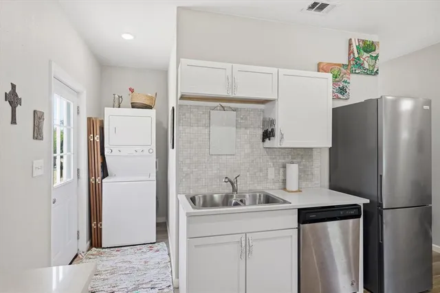 a kitchen with a sink stove and microwave