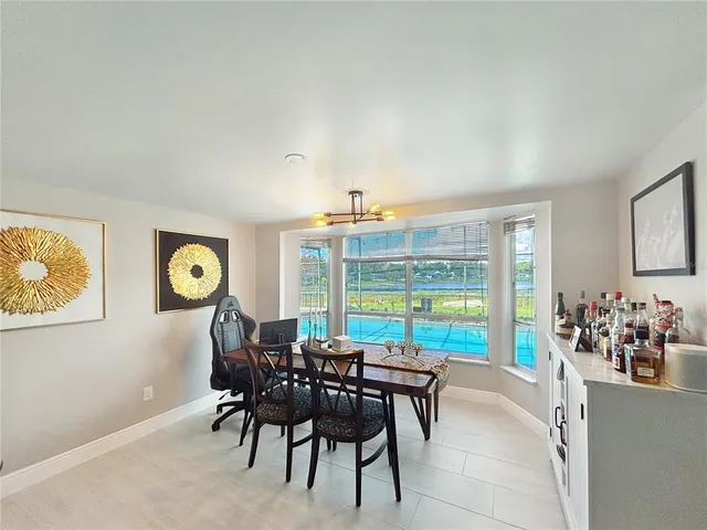 a view of a dining room with furniture window and outside view