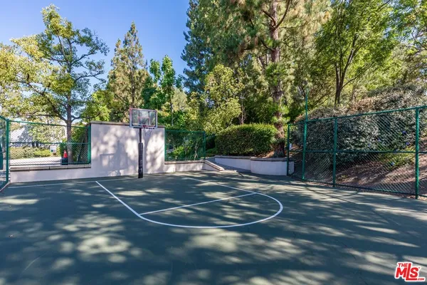 an aerial view of a house with a yard and garden