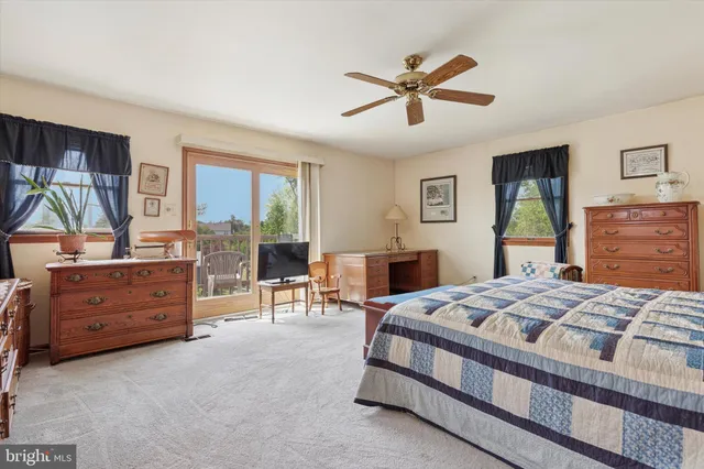 a bed room with a bed and a dresser