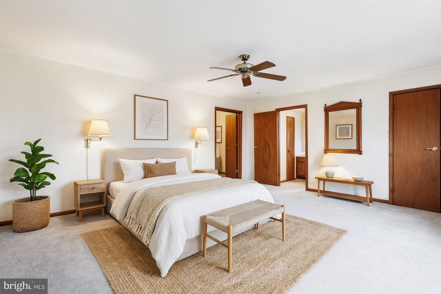 159 Hunt Drive Horsham, PA 19044 - Photo 2 of 31 a spacious bedroom with a bed a couch and potted plant