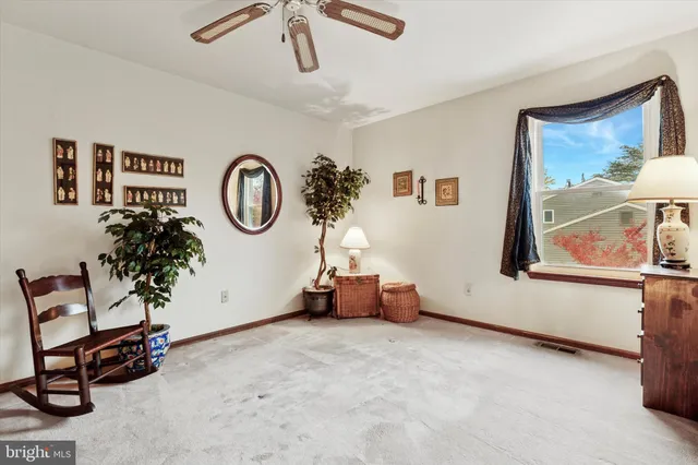 a view of workspace with furniture and window