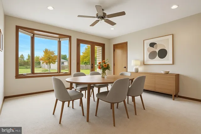 a view of a dining room with furniture window and outside view