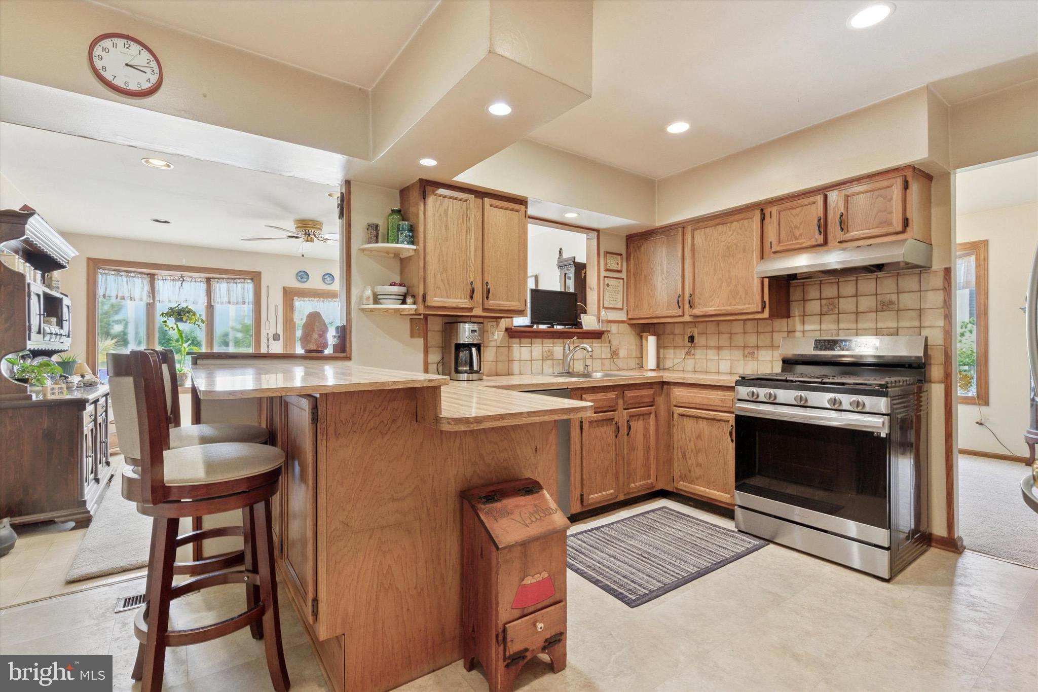 159 Hunt Drive Horsham, PA 19044 - Photo 5 of 31 a kitchen with stainless steel appliances granite countertop a stove top oven a sink dishwasher and a refrigerator