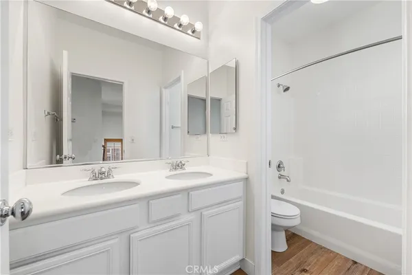 a bathroom with a toilet and bathtub