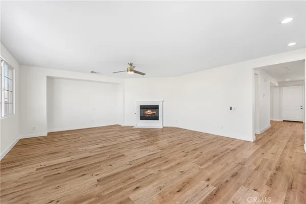 a kitchen with white cabinets and appliances