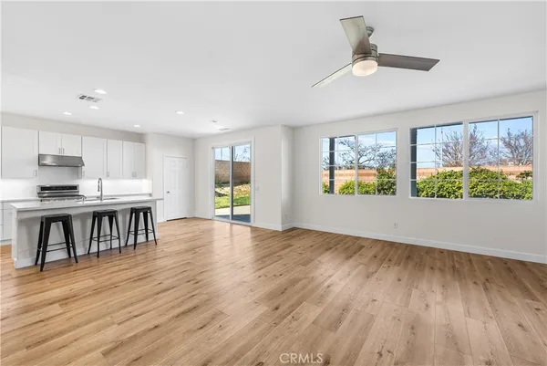 a kitchen with a stove a sink and a refrigerator