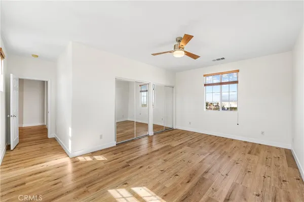 a group of people sitting in front of a house