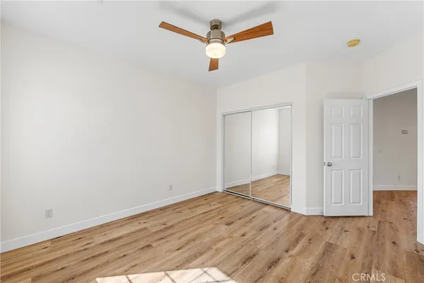 a backyard of a house with swing table and chairs