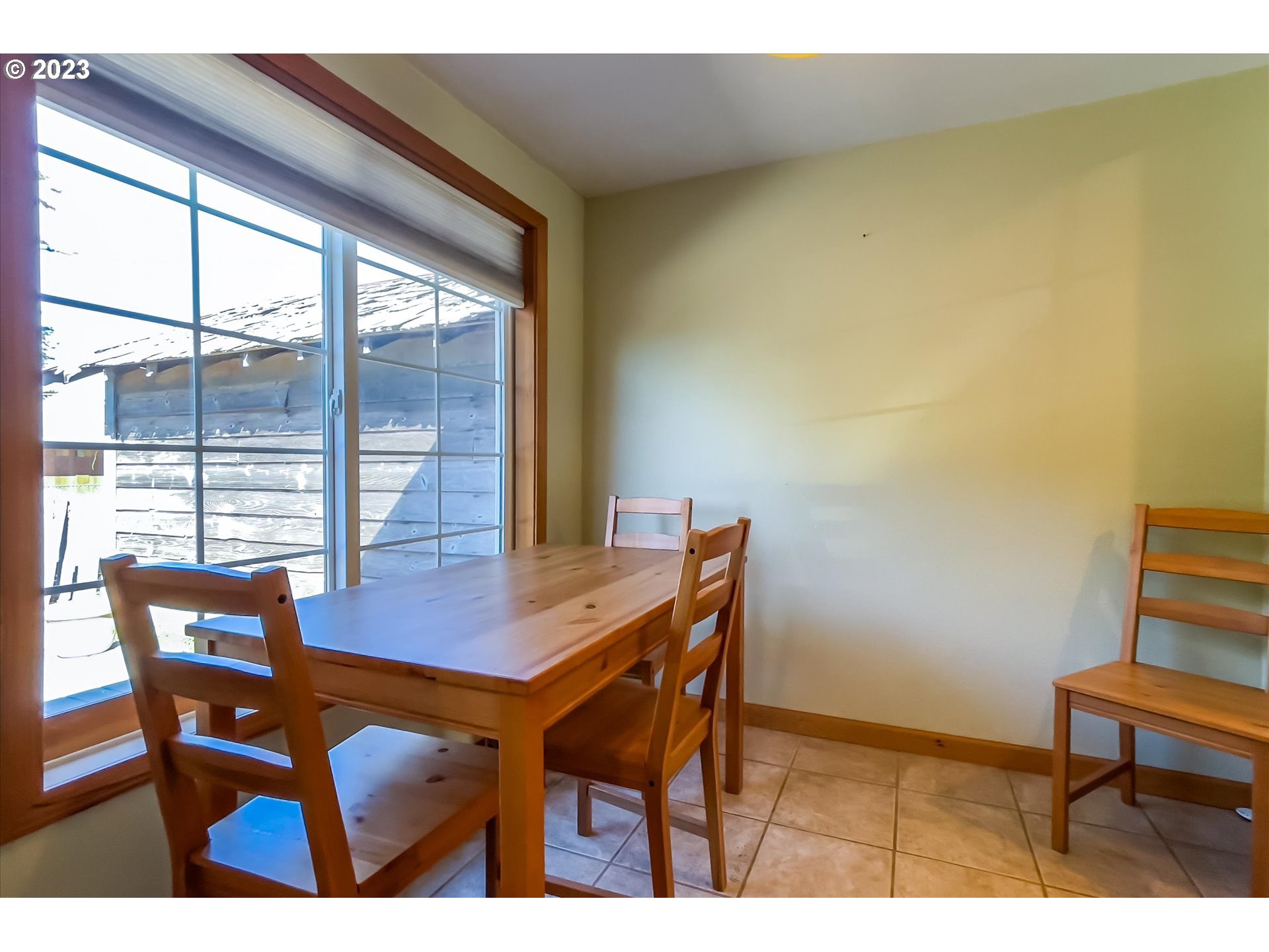 945 2nd Street Southeast Bandon, OR 97411 - Photo 12 of 29 a view of a dining room with furniture and wooden floor