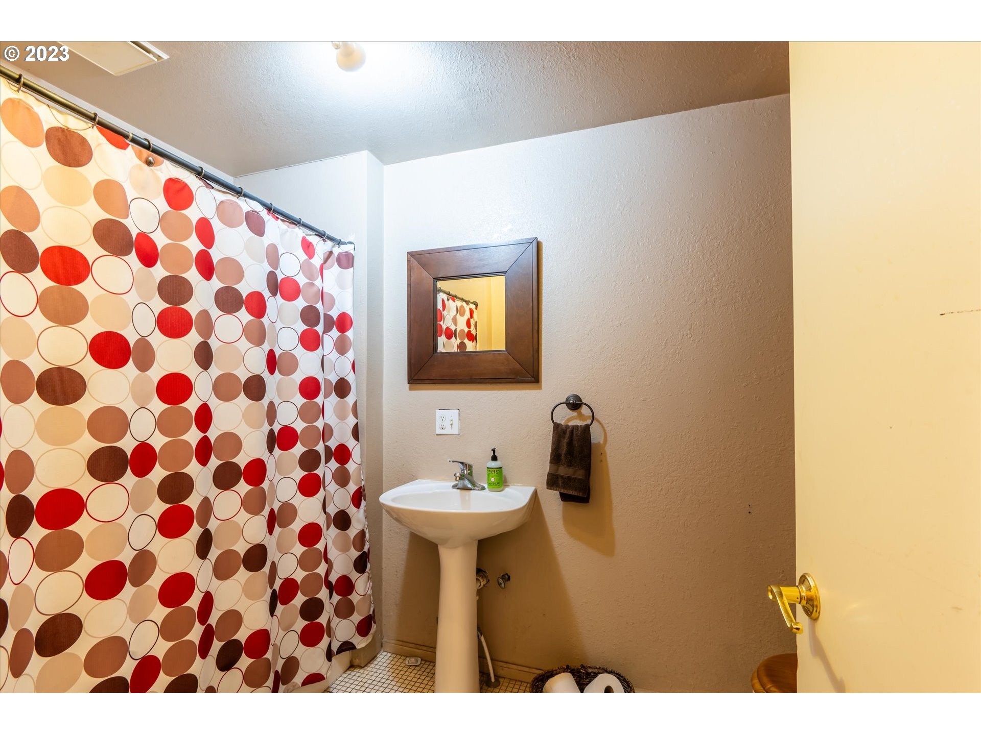 945 2nd Street Southeast Bandon, OR 97411 - Photo 15 of 29 a bathroom with a sink and a mirror
