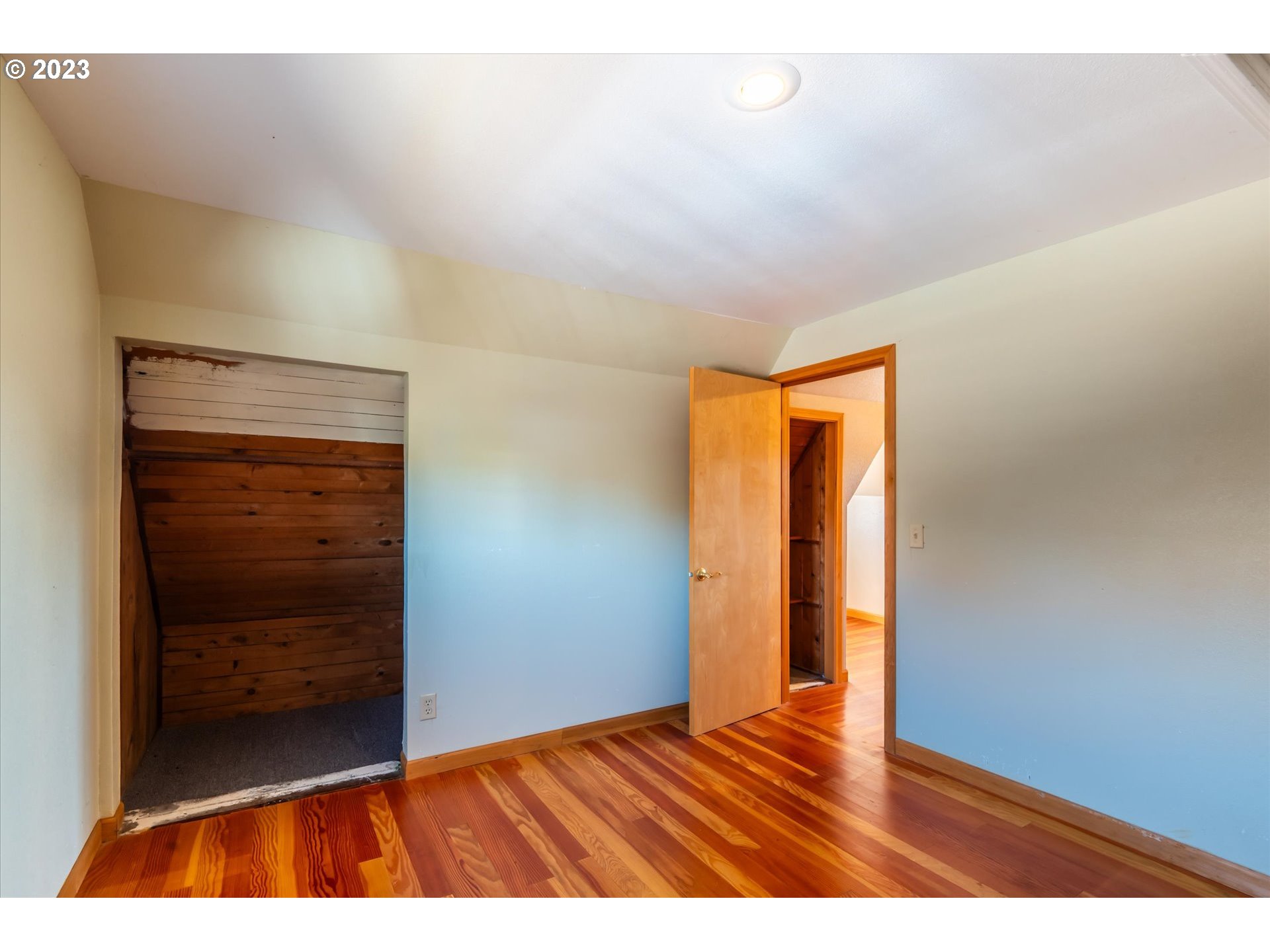 945 2nd Street Southeast Bandon, OR 97411 - Photo 20 of 29 a view of an empty room with wooden floor