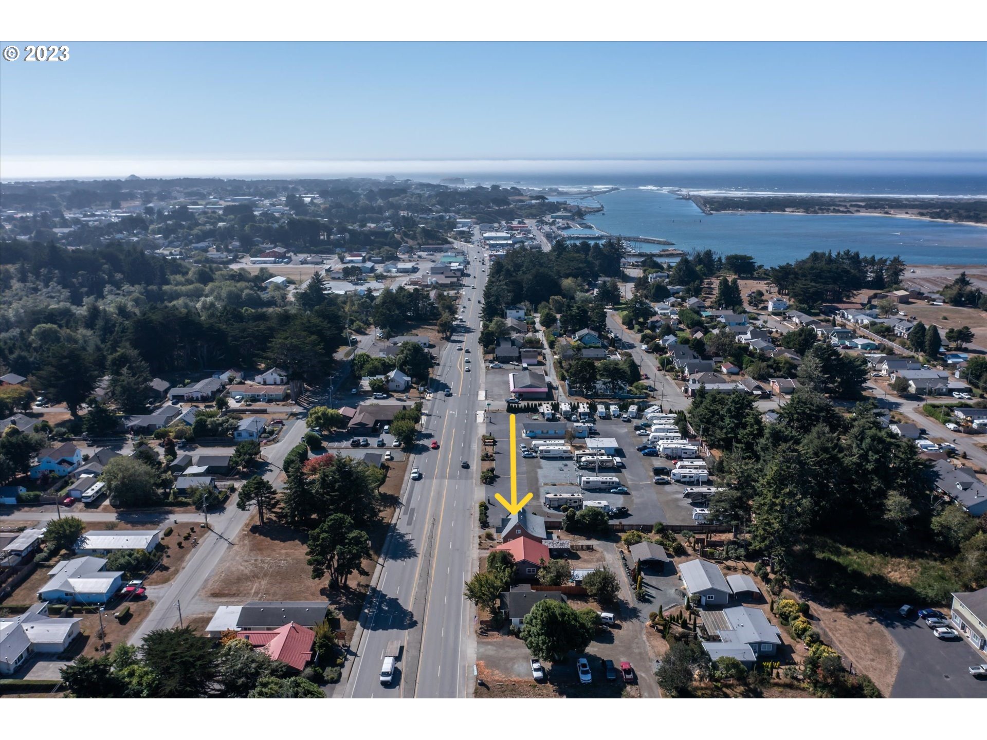 945 2nd Street Southeast Bandon, OR 97411 - Photo 2 of 29 an aerial view of multiple house