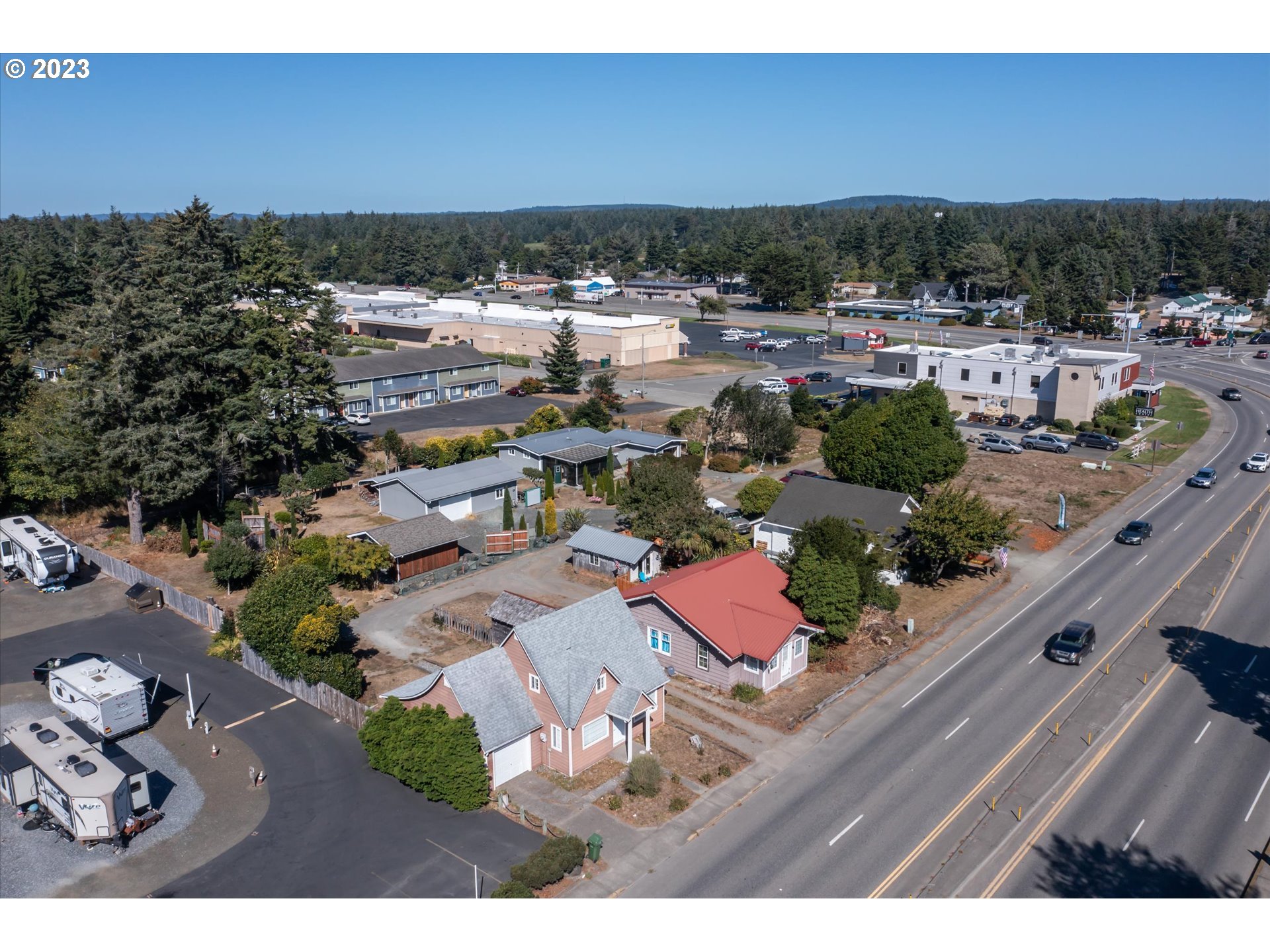 945 2nd Street Southeast Bandon, OR 97411 - Photo 25 of 29 a view of a house with a yard