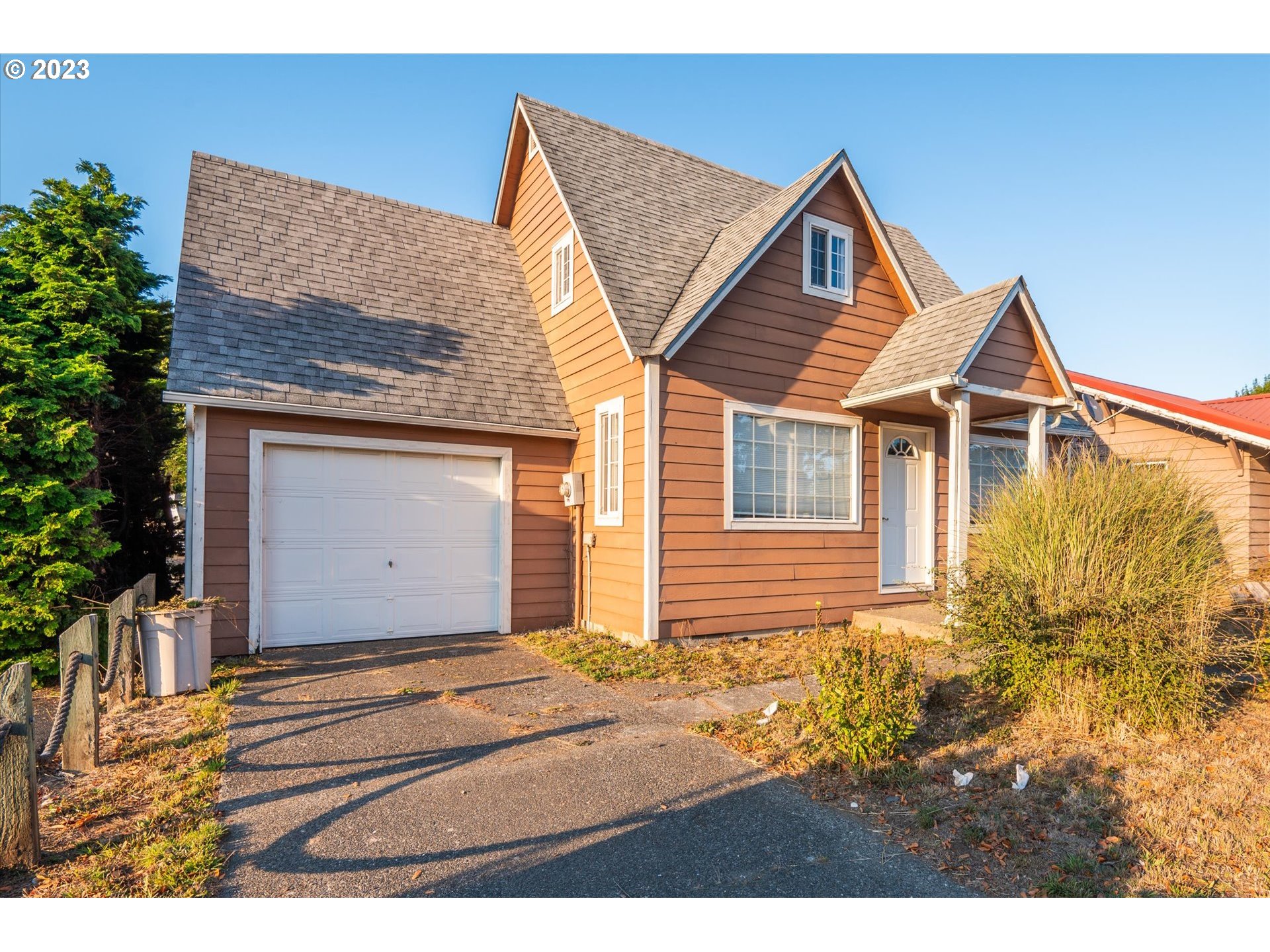 945 2nd Street Southeast Bandon, OR 97411 - Photo 29 of 29 a view of a house with a yard