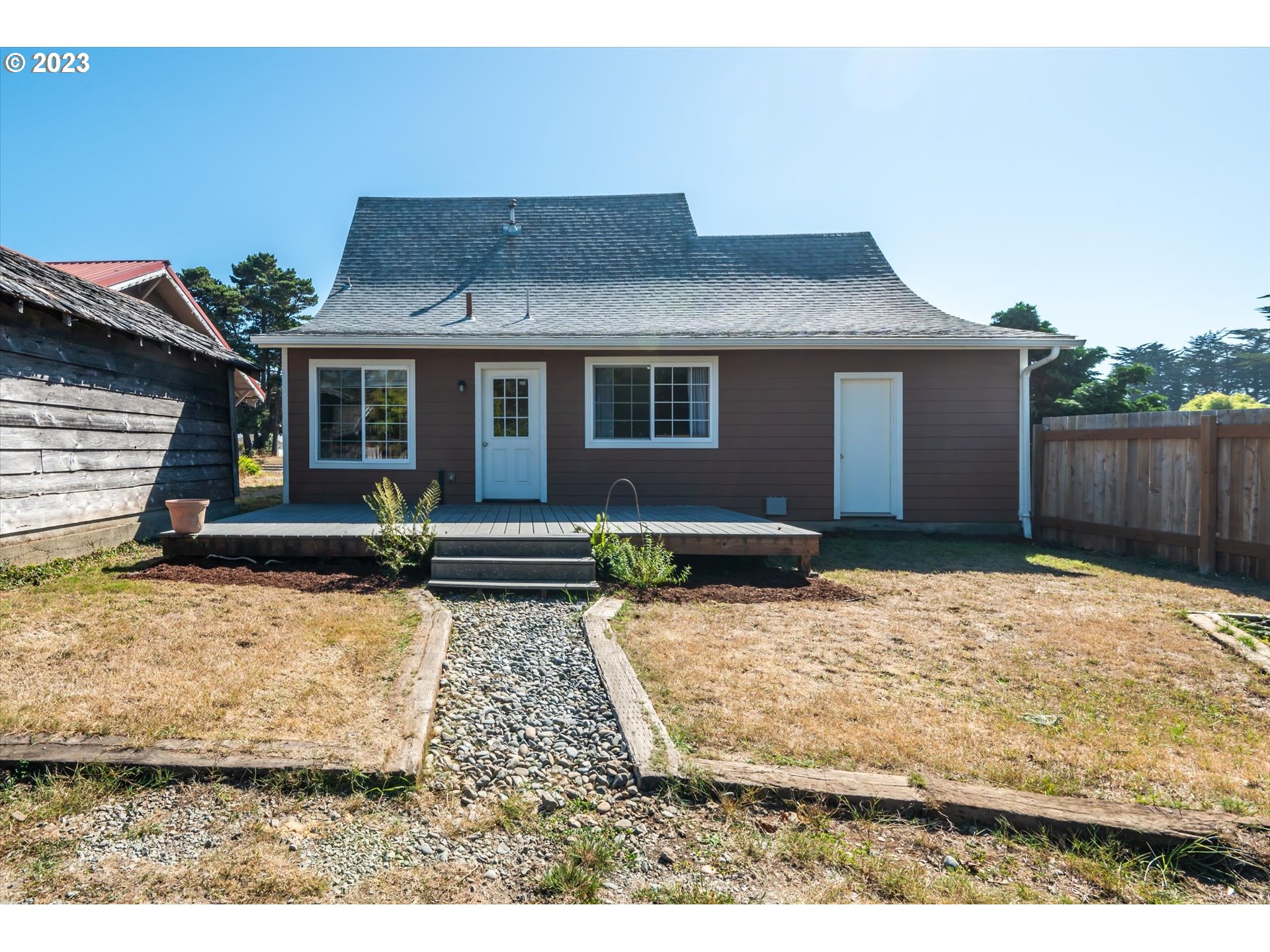 945 2nd Street Southeast Bandon, OR 97411 - Photo 3 of 29 a backyard of a house