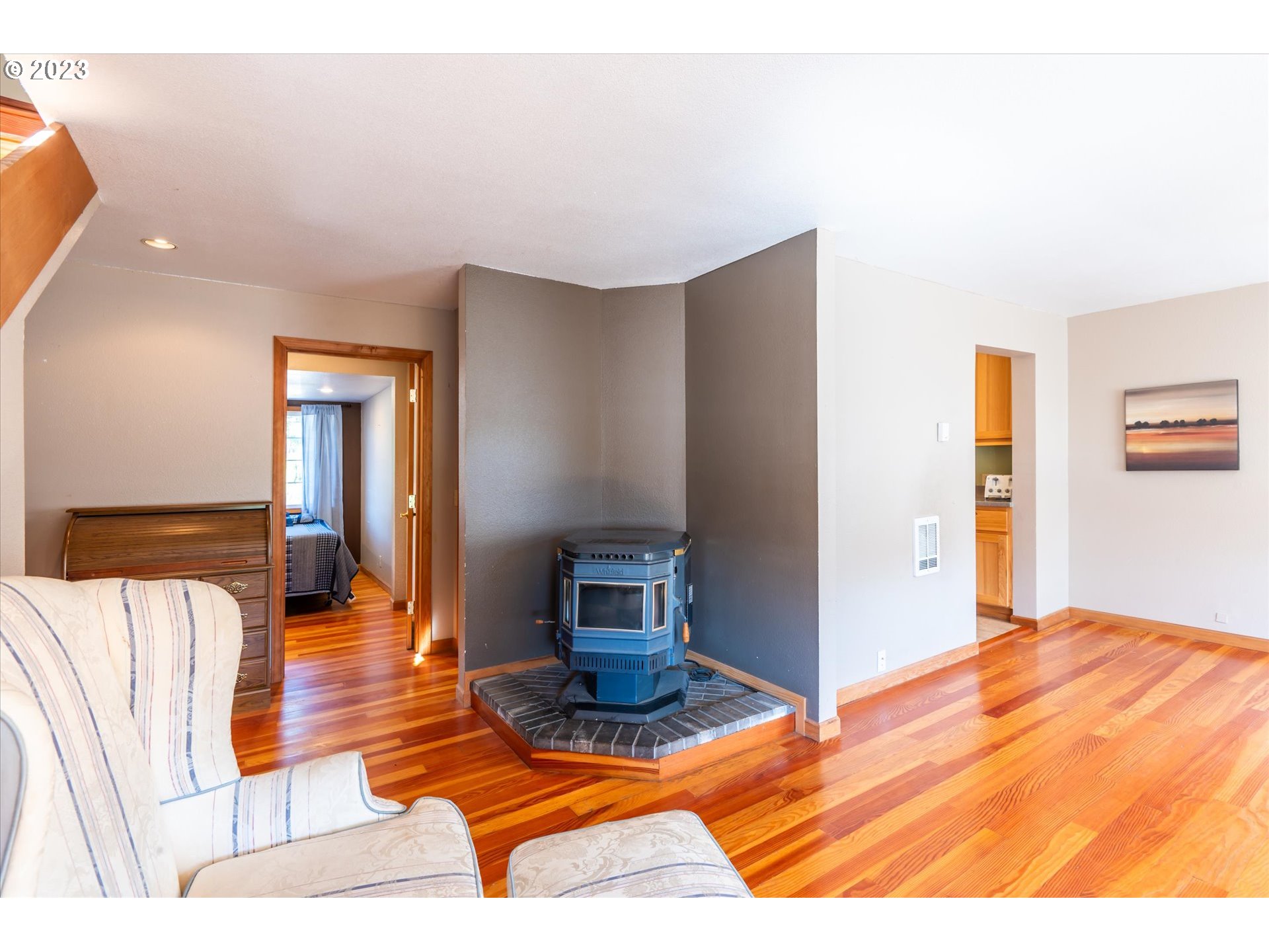 945 2nd Street Southeast Bandon, OR 97411 - Photo 6 of 29 a bedroom with a bed and mirror