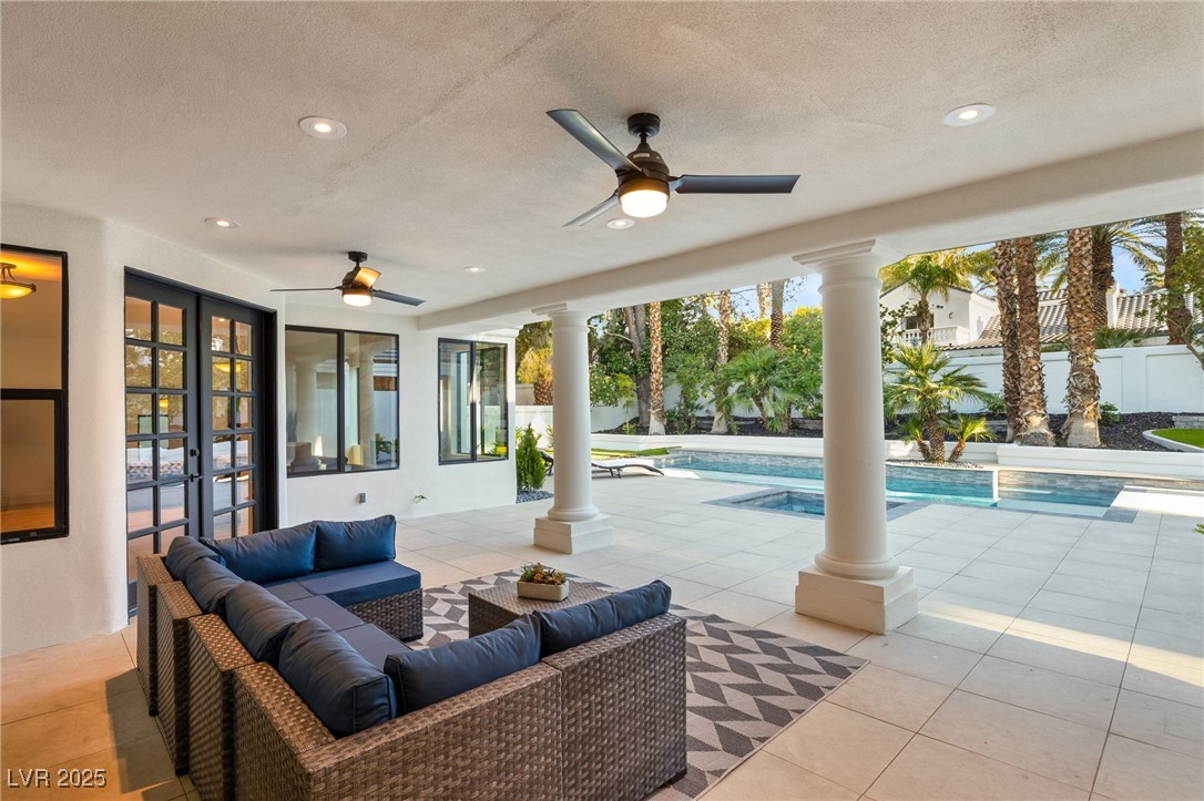 2316 Prometheus Court Henderson, NV 89074 - Photo 53 of 92 View of patio with a ceiling fan, fence, an outdoor hangout area, an outdoor pool, and french doors