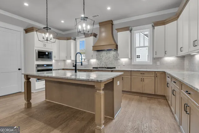 a room with walk in closet with empty racks