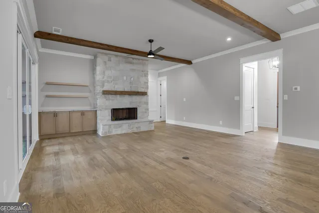 a kitchen with kitchen island granite countertop a sink cabinets and stainless steel appliances