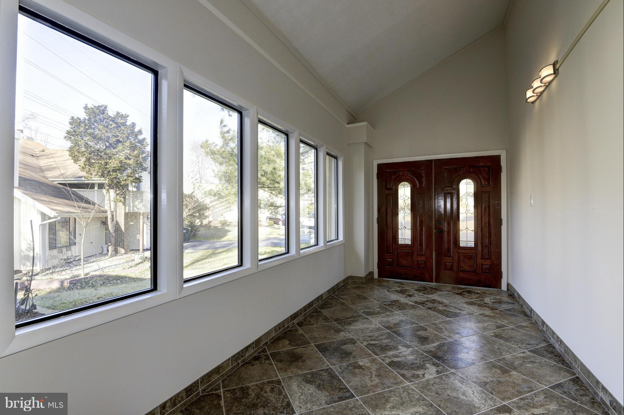 5911 Hall Street Springfield, VA 22152 - Photo 3 of 30 Custom Enclosed Foyer with Travertine Tiles