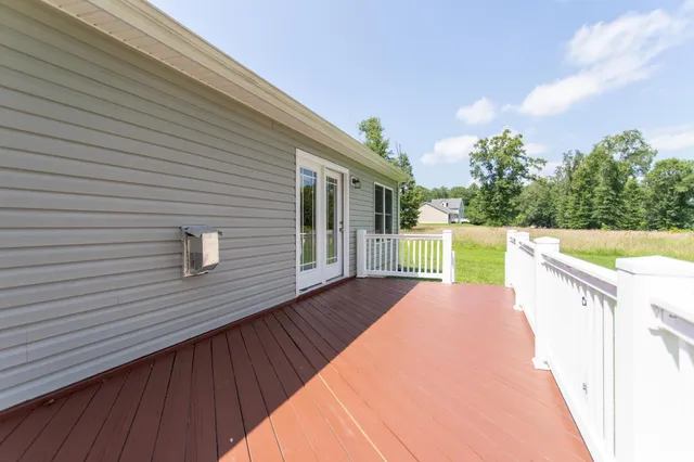 a view of yard with swimming pool and trees