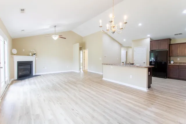 a view of a kitchen with a sink and a large mirror