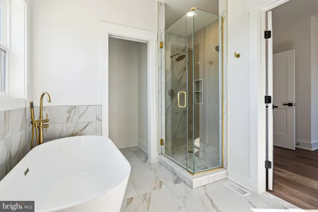 a bathroom with a sink and shower