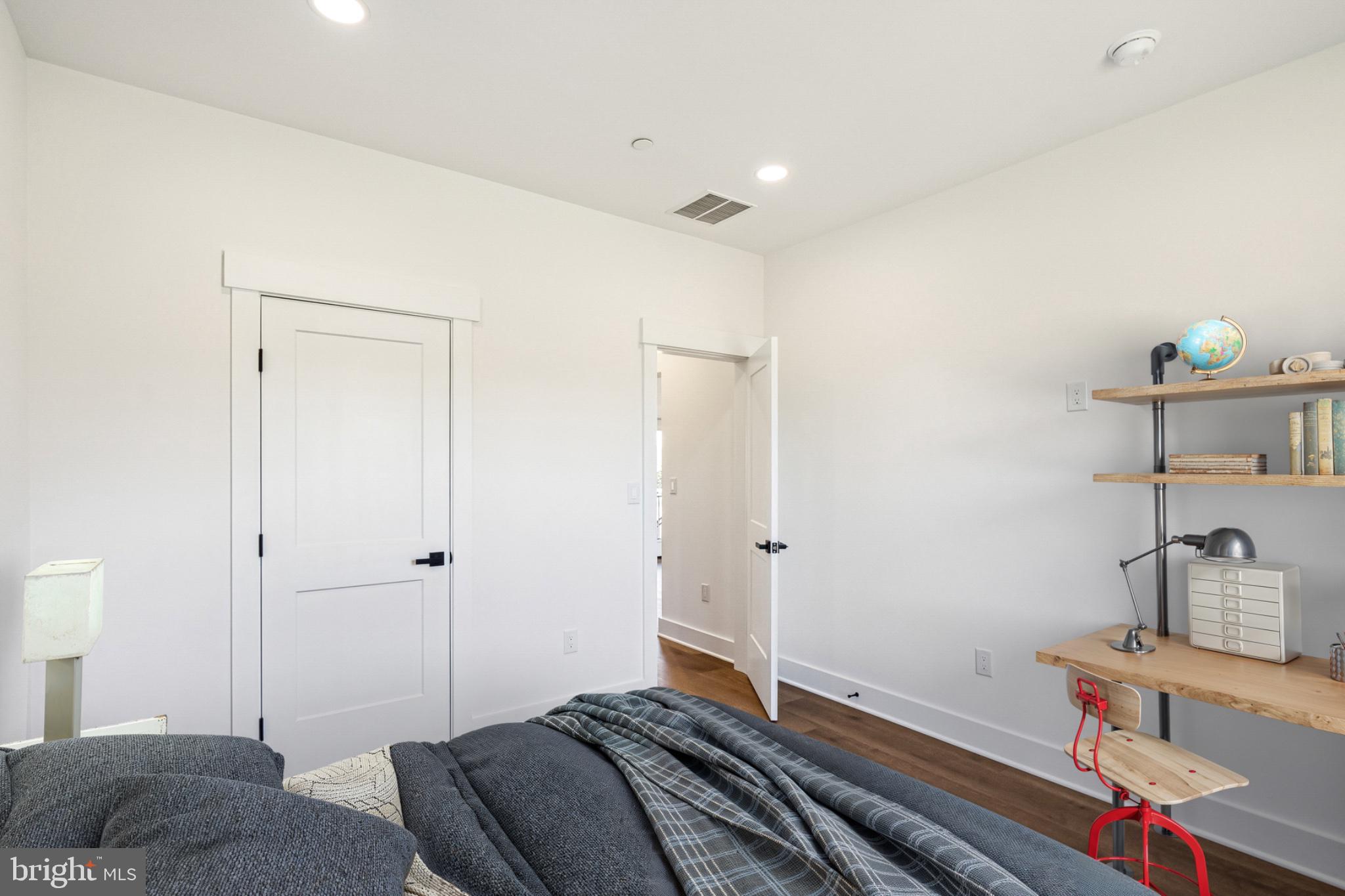 3651 Hanover Pike Manchester, MD 21102 - Photo 26 of 30 a bedroom with a bed and a chandelier