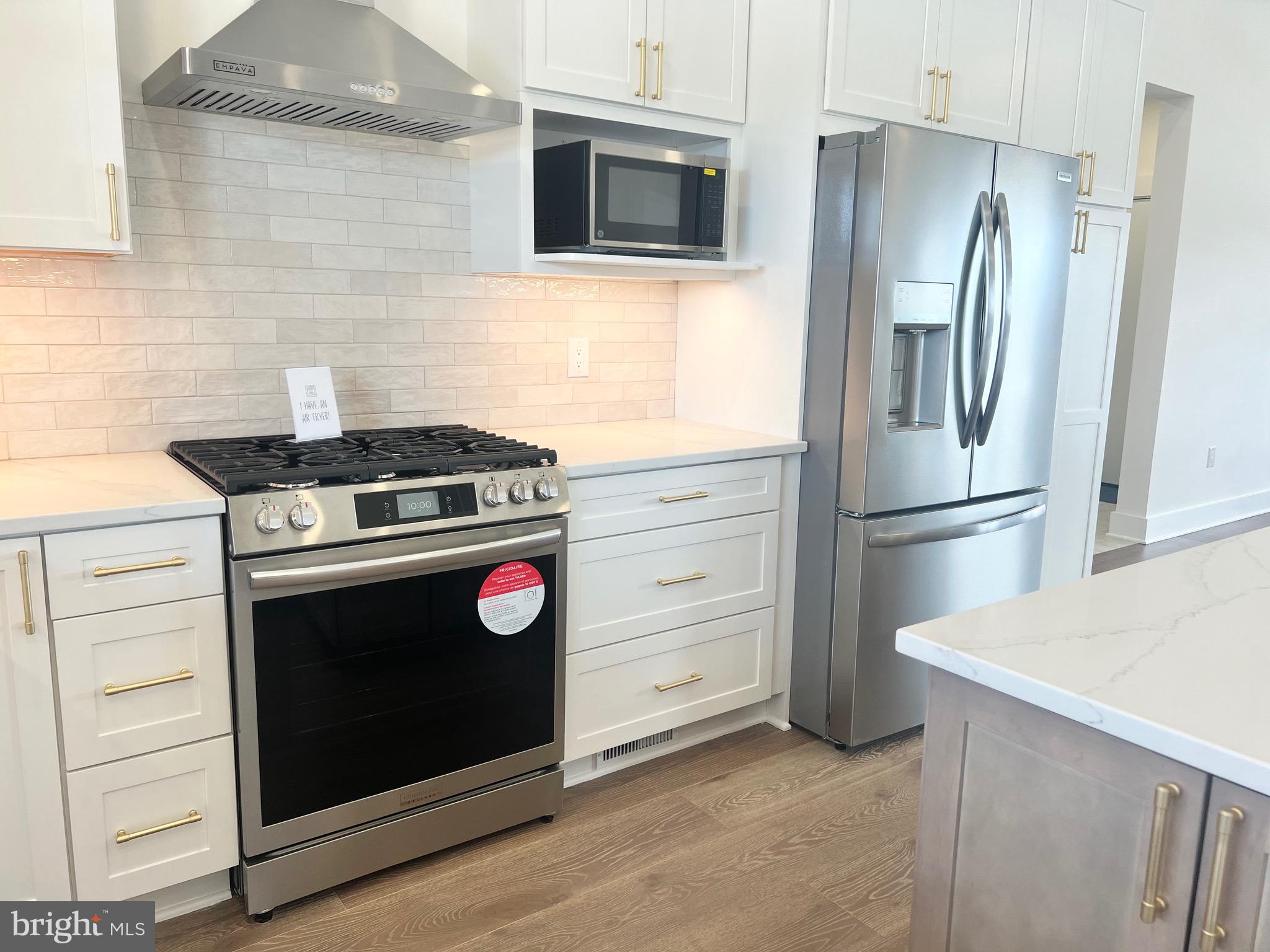 3651 Hanover Pike Manchester, MD 21102 - Photo 6 of 16 a kitchen with stainless steel appliances and cabinets