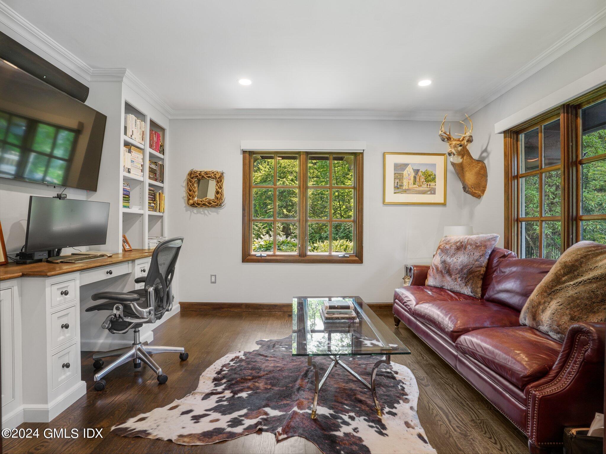 80 Porchuck Road Greenwich, CT 06831 - Photo 13 of 29 a living room with furniture and a flat screen tv