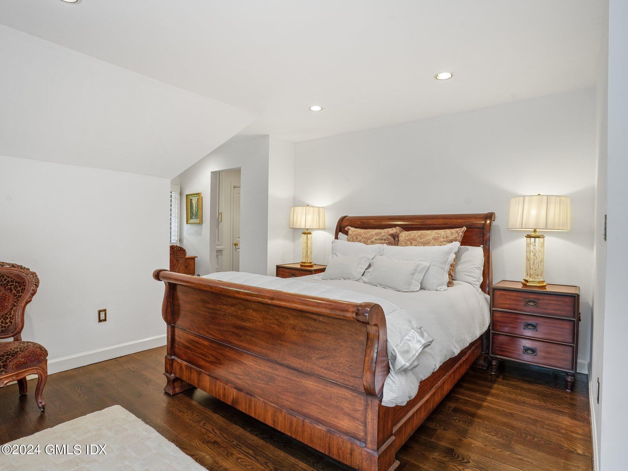 80 Porchuck Road Greenwich, CT 06831 - Photo 16 of 29 a bedroom with a bed and a chair