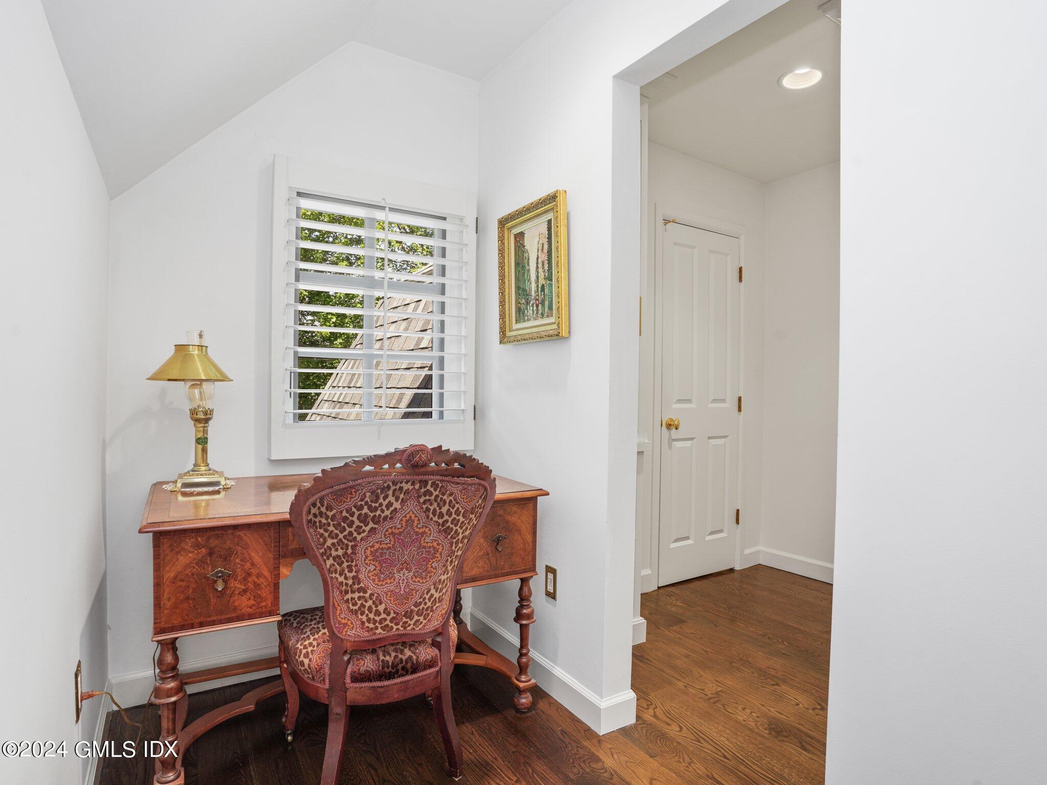 80 Porchuck Road Greenwich, CT 06831 - Photo 17 of 29 a view of a workspace with furniture and a window