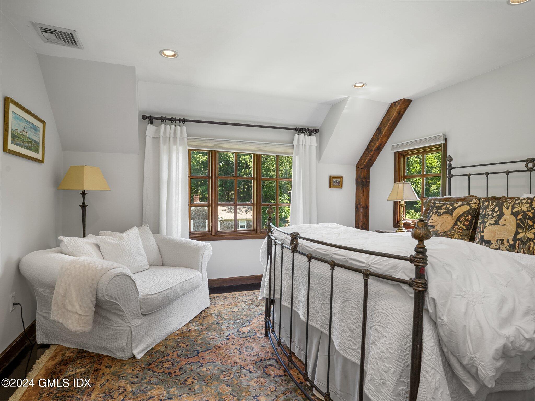 80 Porchuck Road Greenwich, CT 06831 - Photo 19 of 29 a bed room with furniture and a window