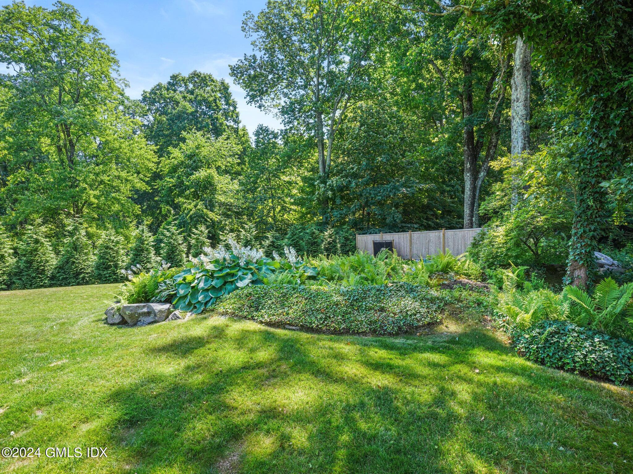 80 Porchuck Road Greenwich, CT 06831 - Photo 23 of 29 a view of garden with trees and grass