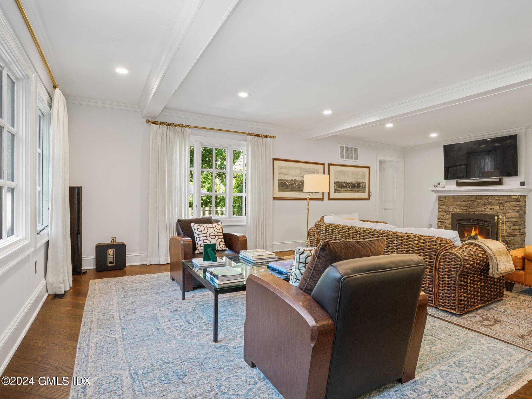 80 Porchuck Road Greenwich, CT 06831 - Photo 7 of 29 a living room with furniture and a fireplace