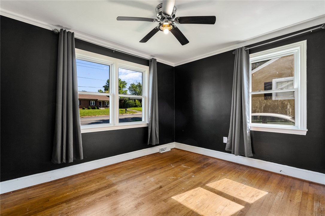 419 Whitehall Road Anderson, SC 29625 - Photo 15 of 28 Hardwood floors and generous windows illuminate this versatile interior space.