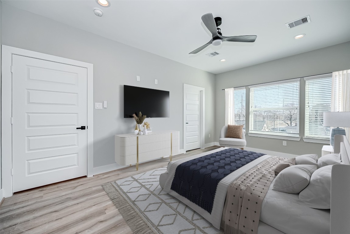 1718 Hardy Street Houston, TX 77026 - Photo 14 of 23 a bedroom with a bed tv and a window