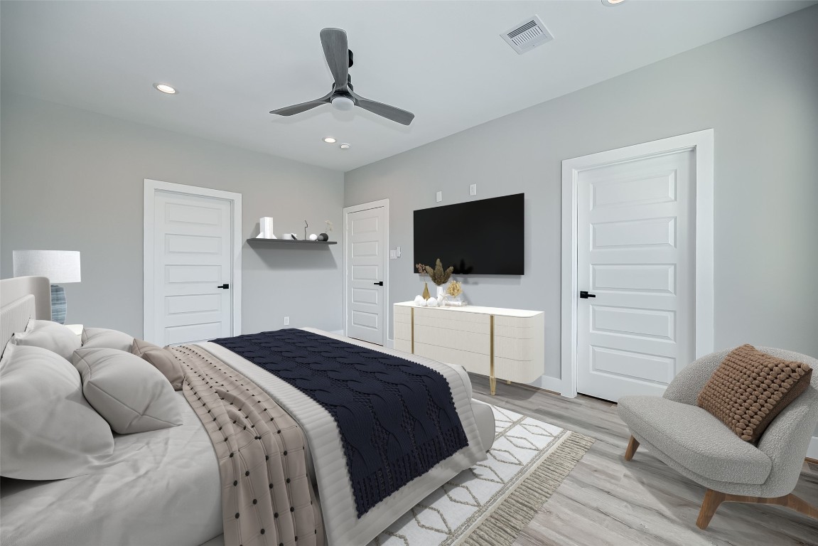 1718 Hardy Street Houston, TX 77026 - Photo 15 of 23 a bedroom with a bed tv and chair