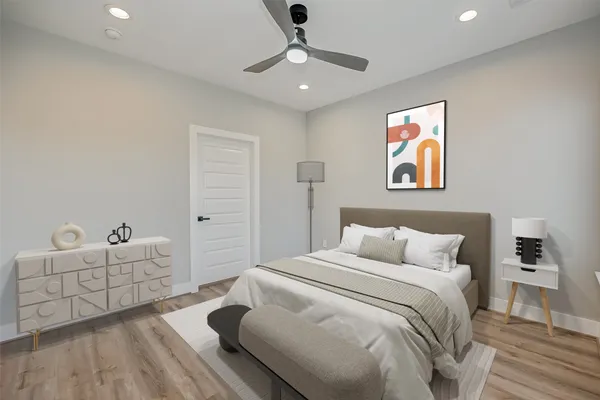 a bedroom with a bed and a couch