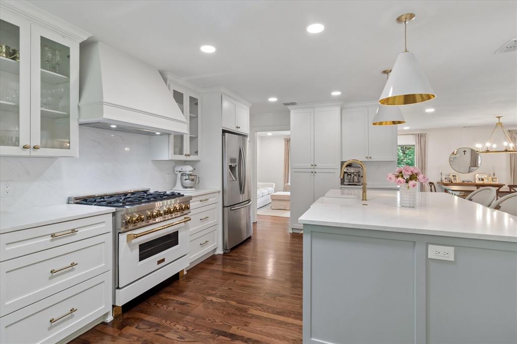 11439 Rosser Road Dallas, TX 75229 - Photo 13 of 35 a kitchen with a sink stainless steel appliances and cabinets