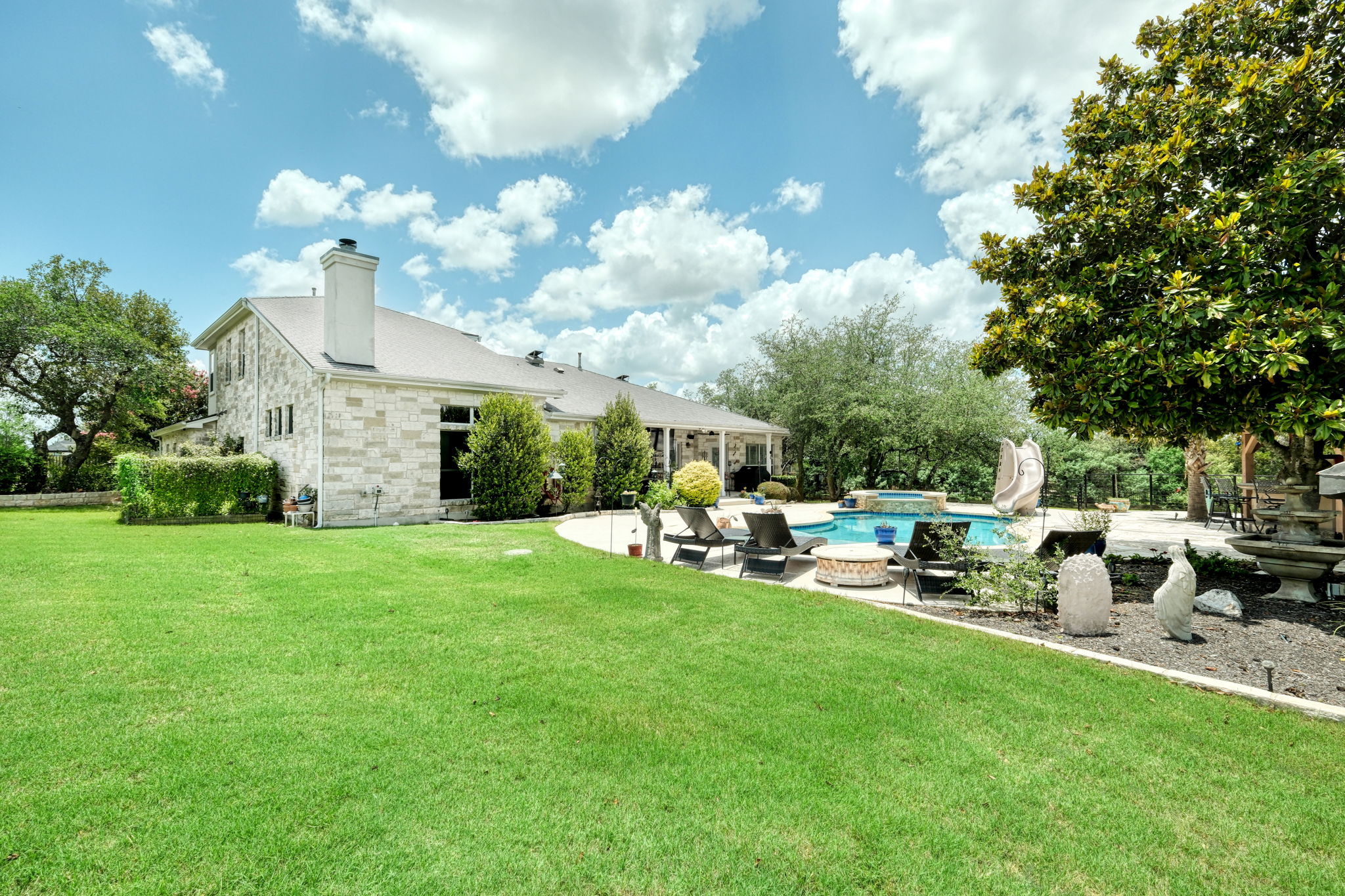 1601 Coronado Leander, TX 78641 - Photo 29 of 37 a view of a house with backyard sitting area and garden