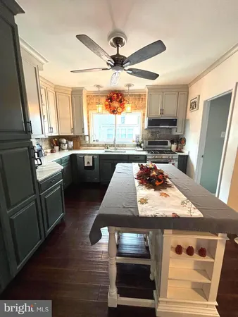 a kitchen with stainless steel appliances granite countertop a stove and a refrigerator