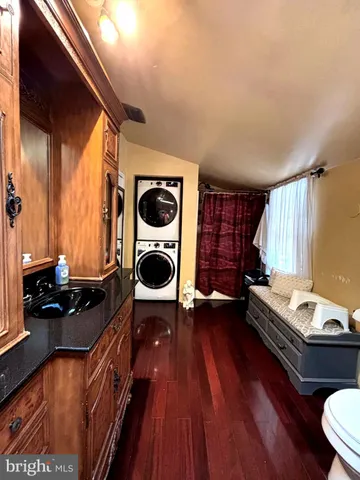 a living room with a bed and cabinets