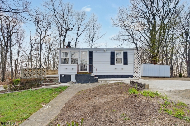 10 Berton Road Boonton, NJ 07005 - Photo 1 of 20 a front view of a house with a yard and garage