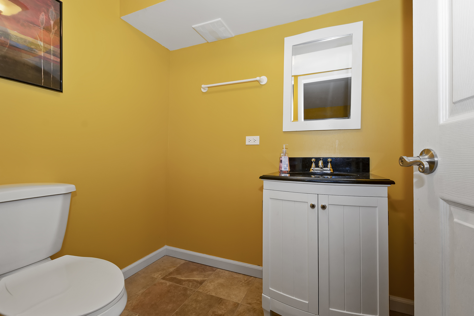 1010 Eagle Point Drive Matteson, IL 60443 - Photo 23 of 27 a bathroom with a toilet sink and mirror